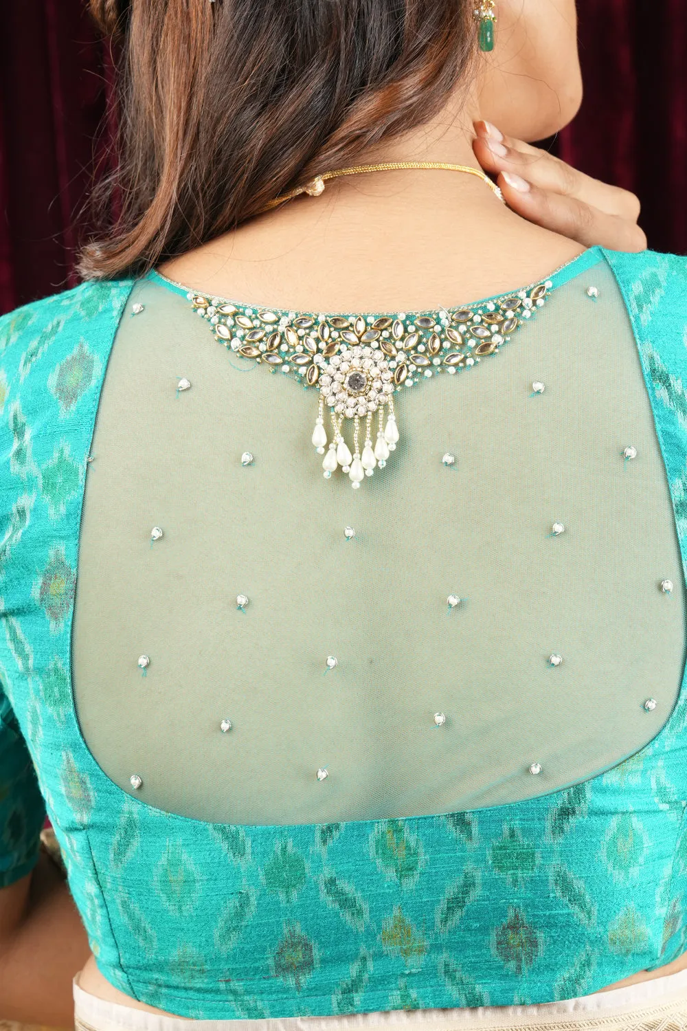 Cyan Pure ikkat Raw silk blouse with Rhinestone detailing in back and sleeves